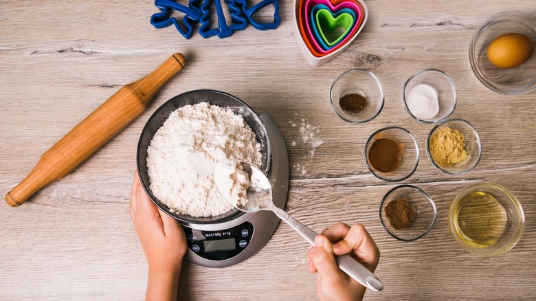 Person measuring ingredients for baking