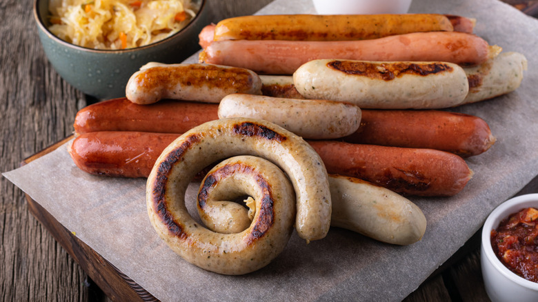 Platter of various sausages on cutting board