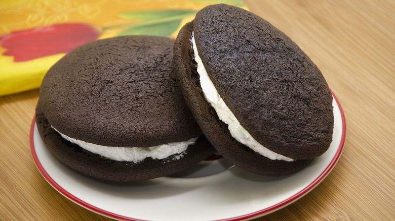 two chocolate whoopie pies on a plate