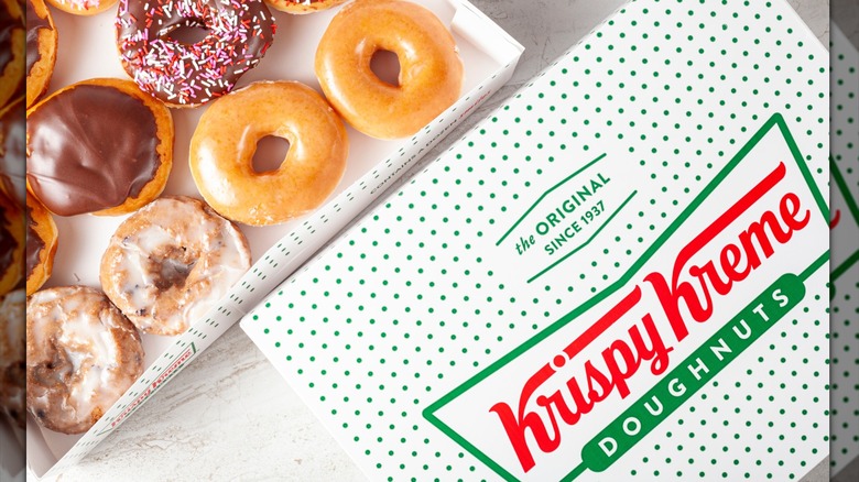 open box of Krispy Kreme donuts in various flavors