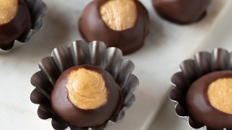close-up of buckeye candies in tin shells
