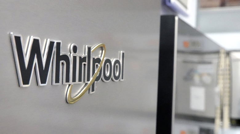 Closeup of Whirlpool logo on a refrigerator on display inside a home improvement store