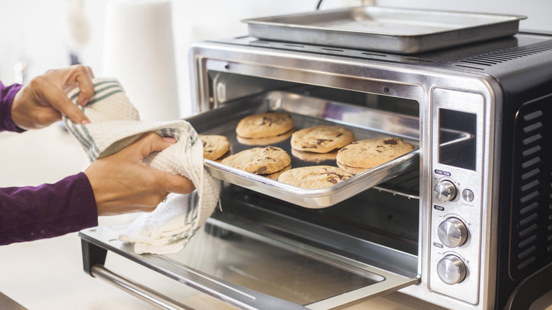 Pulling tray out of toaster oven