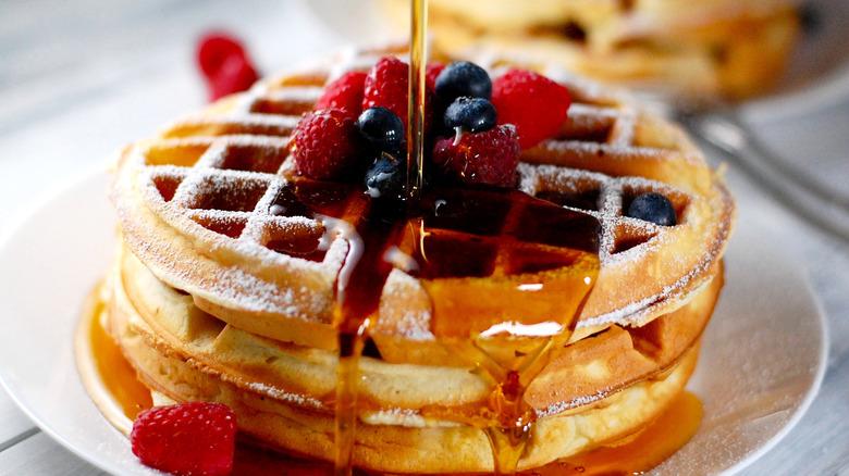 Waffles with berries and syrup