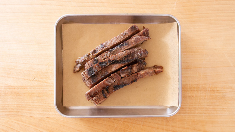 sliced steak in pan