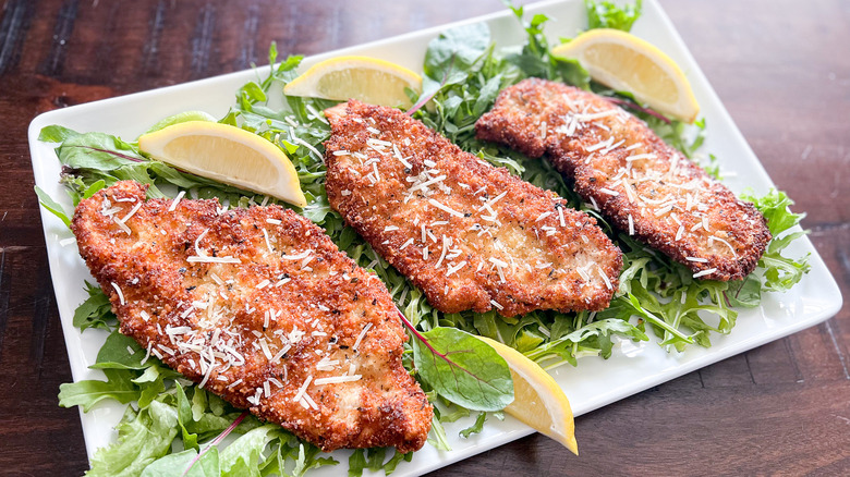 fried chicken breasts on lettuce