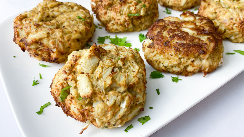 Plated crab cakes with parsley