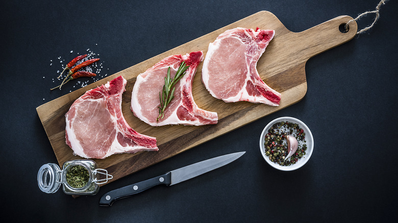 pork chops on cutting board