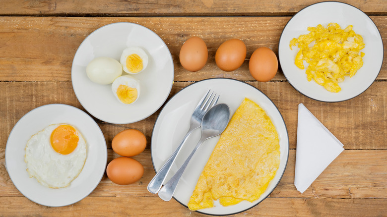 Various types of cooked eggs on plates