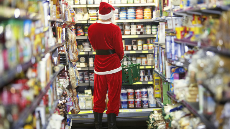 Person in Santa suit shopping in grocery store