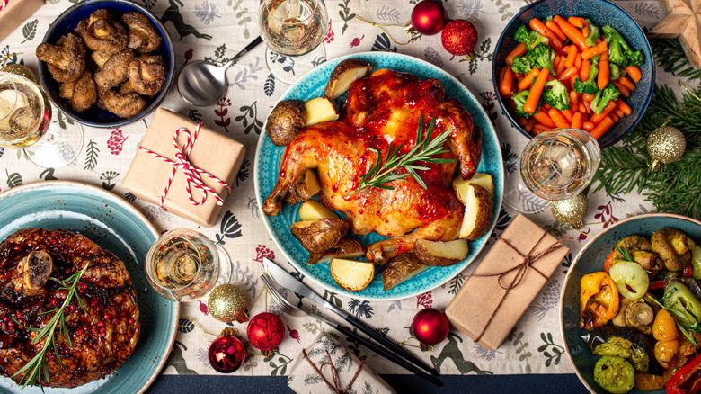 A Christmas dinner table with turkey and various sides