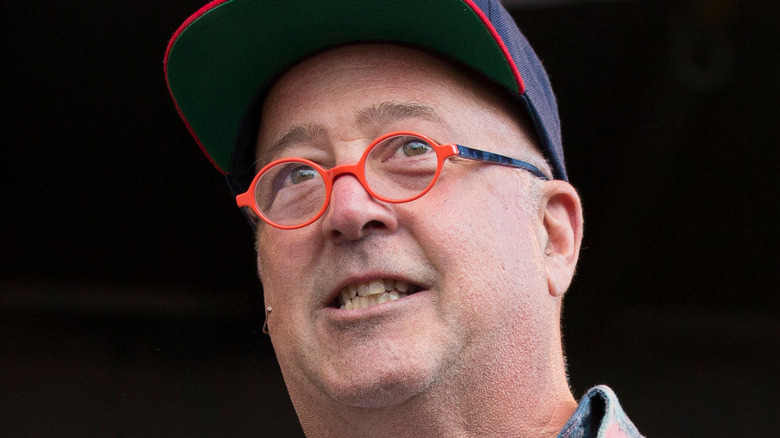 Andrew Zimmern wearing cap