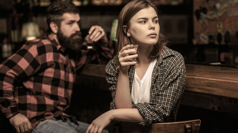 Couple drinking in bar