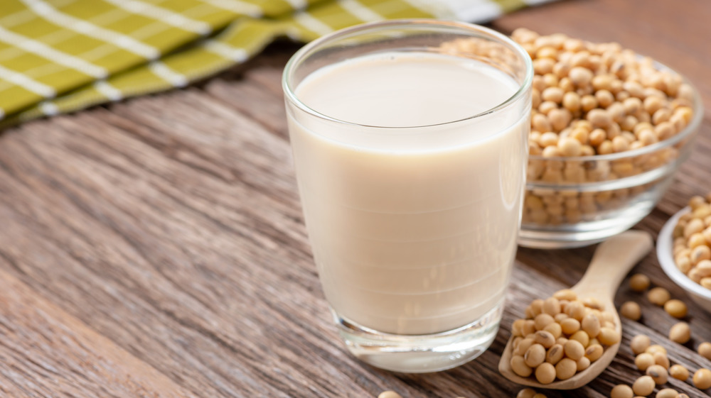 Glass of soy milk with soybeans