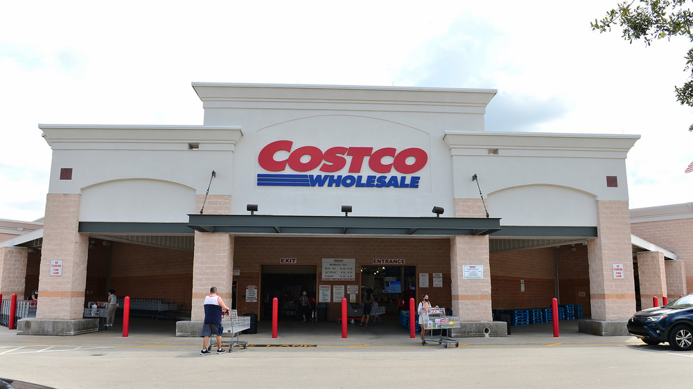 Costco storefront and customers