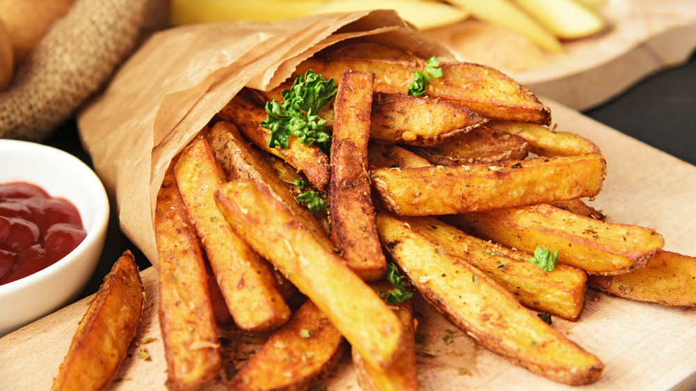 French fries in a bag with parsley