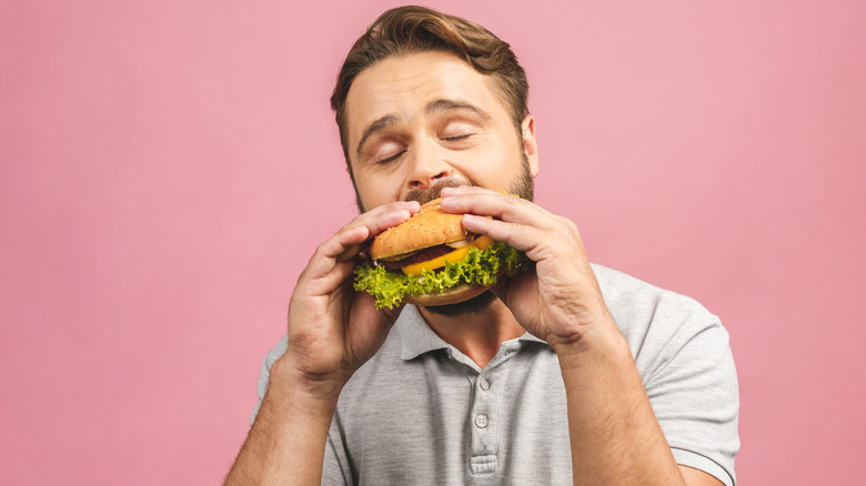 Man eating hamburger