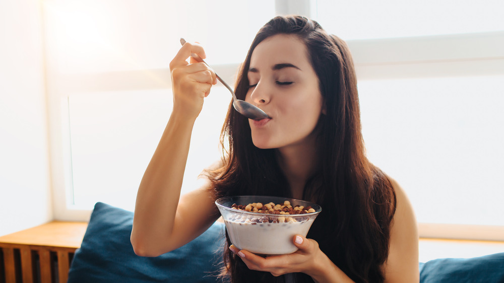 Woman eating cereal