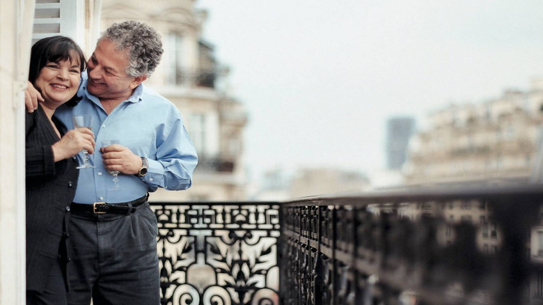 Ina Garten and husband Jeffrey smiling and laughing on their terrace in Paris