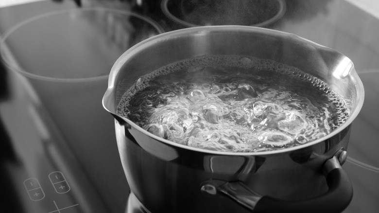 Boiling hot water on stove