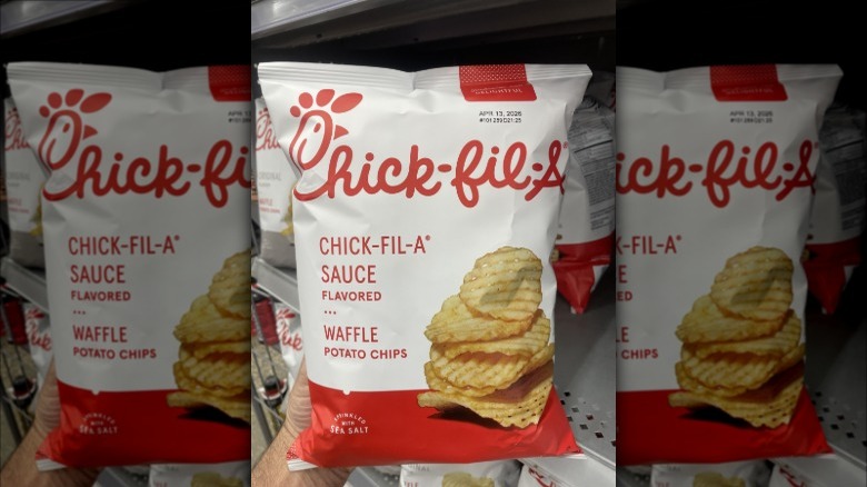 Hand holding a bag of Chick-fil-A sauce potato chips