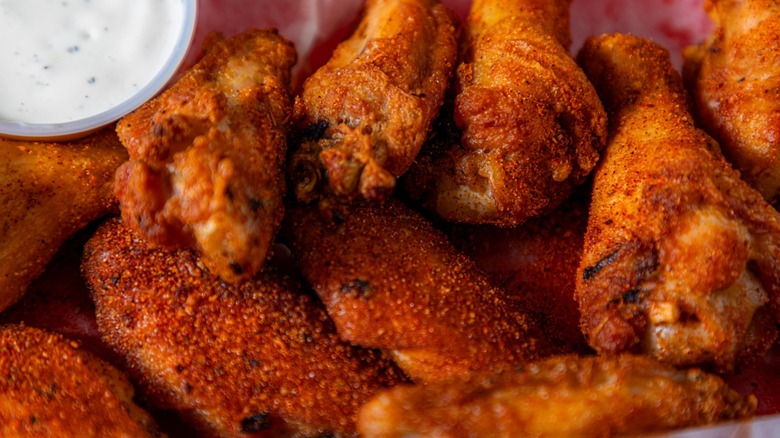 Close-up of wings and ranch dipping sauce
