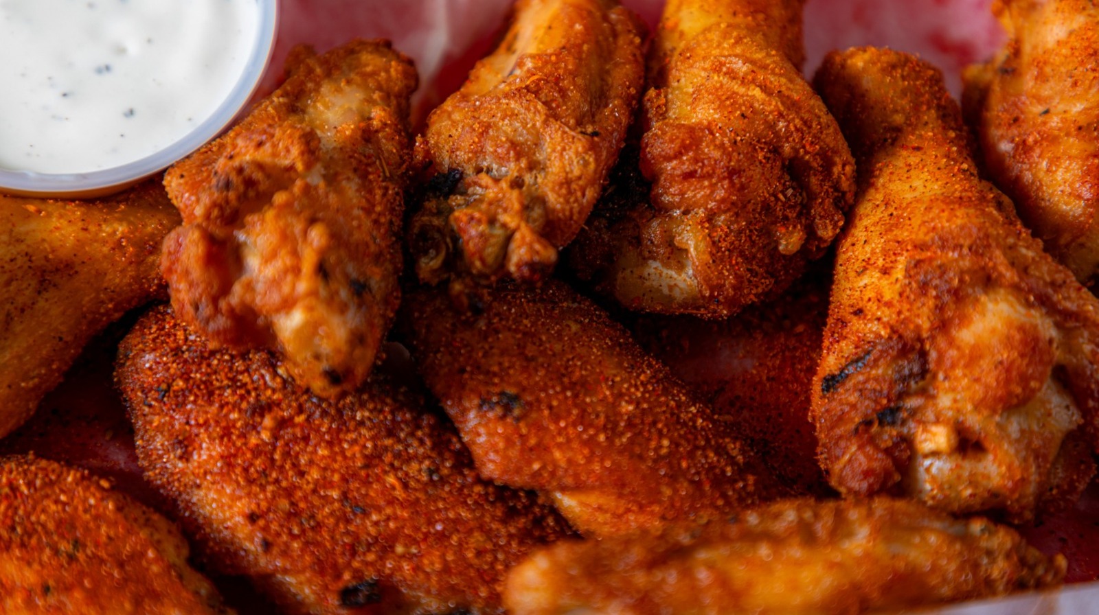 Where Hot Ones' Chicken Wings Come From (And Why It's Not Always The Same Spot)