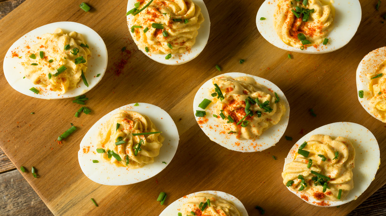 Deviled eggs on cutting board