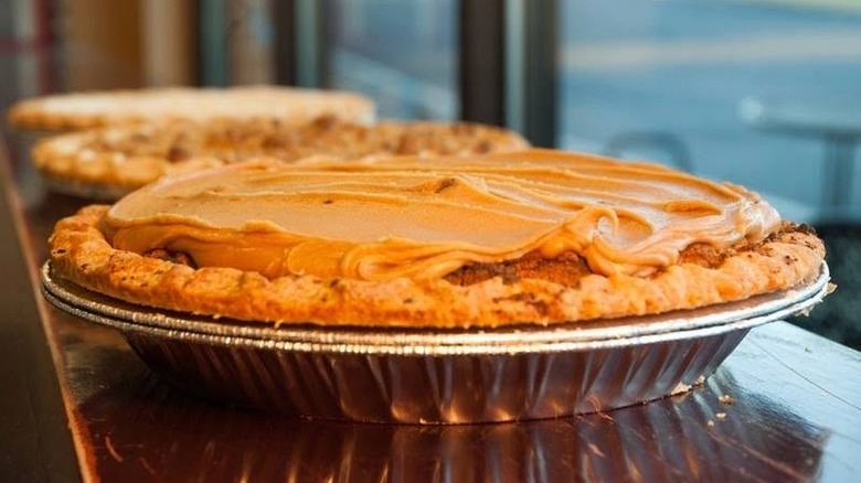 caramel Dutch apple pie in tin on counter