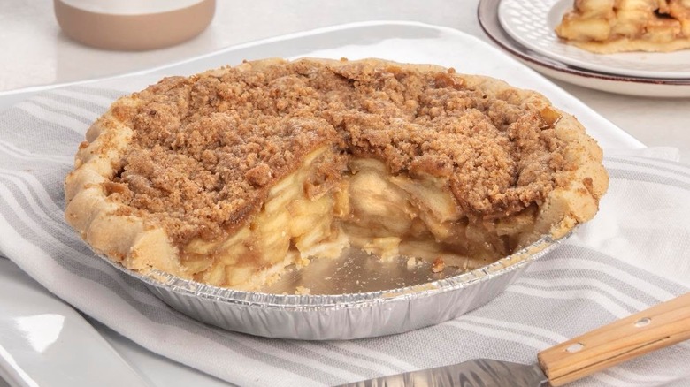 cinnamon apple pie in tin on plate