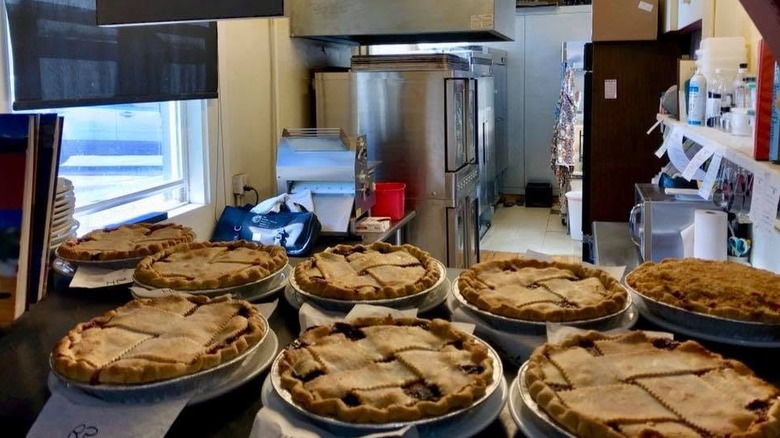 fresh baked lattice crust pies with kitchen in background