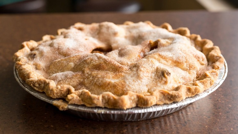 apple pie in tin on counter