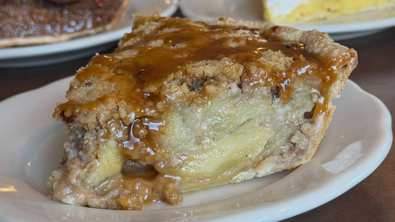slice of caramel apple pie on white plate