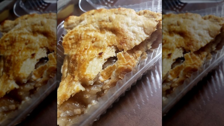 slice of apple pie in plastic go container