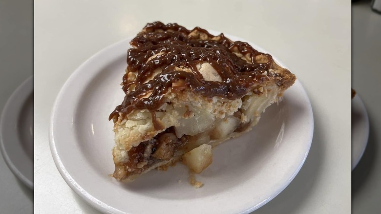 caramel apple pie slice on white plate