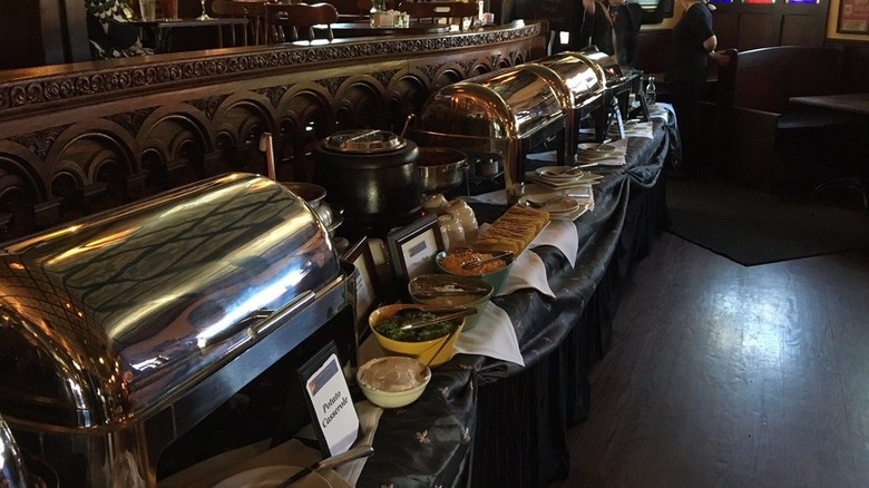 The brunch buffet display at Chief O'Neill's Pub showing silver serving dishes.