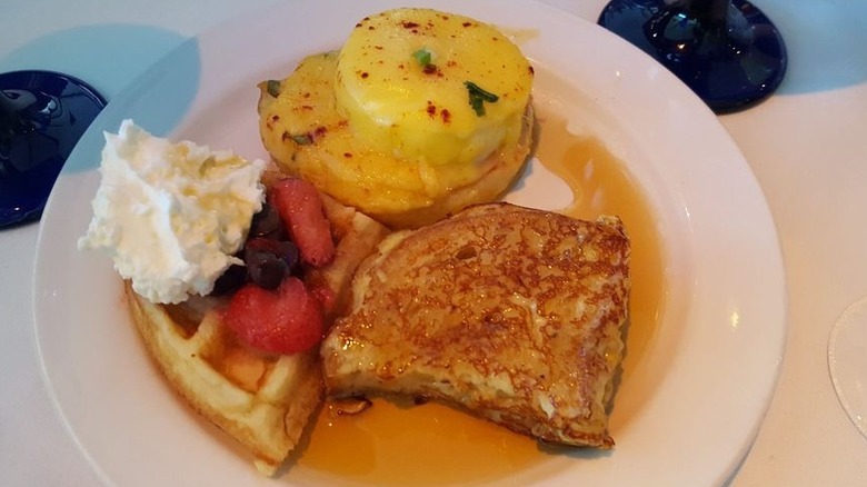 French toast, waffles, syrup, and fruit.