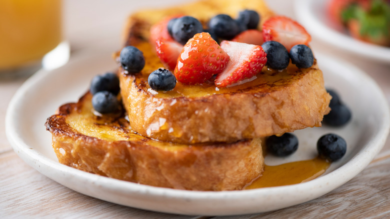 French toast with syrup and fresh berries