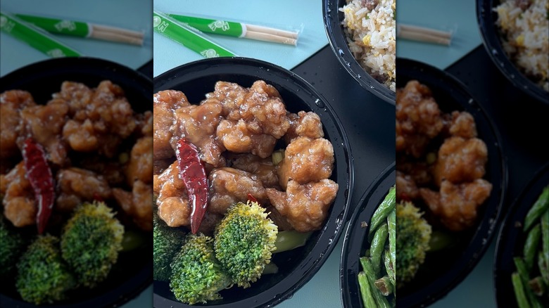 EMei Restaurant's General Tso's chicken and broccoli on table with side dishes