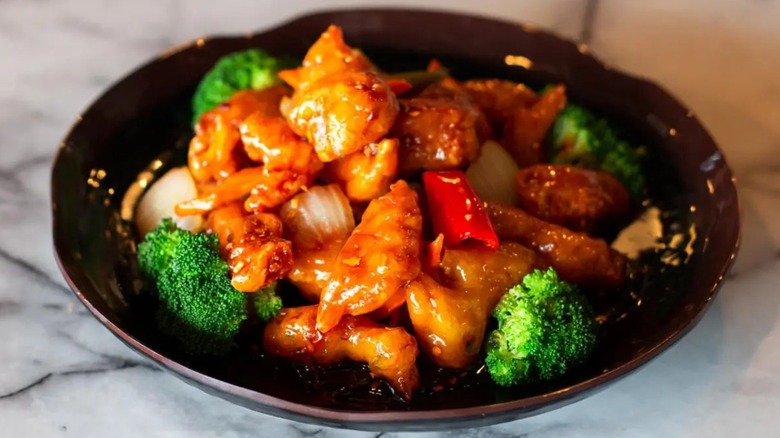 General Tso's chicken in black bowl from Hong Kong Station in Denver