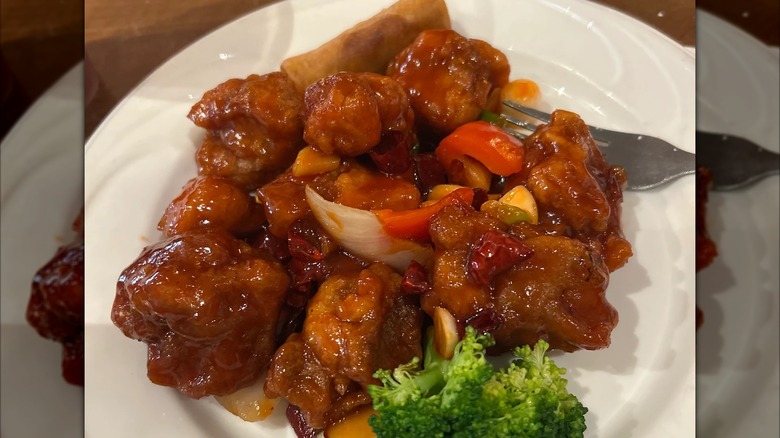 Plate of saucy General Tso's chicken with broccoli from Trendy Dumpling restaurant