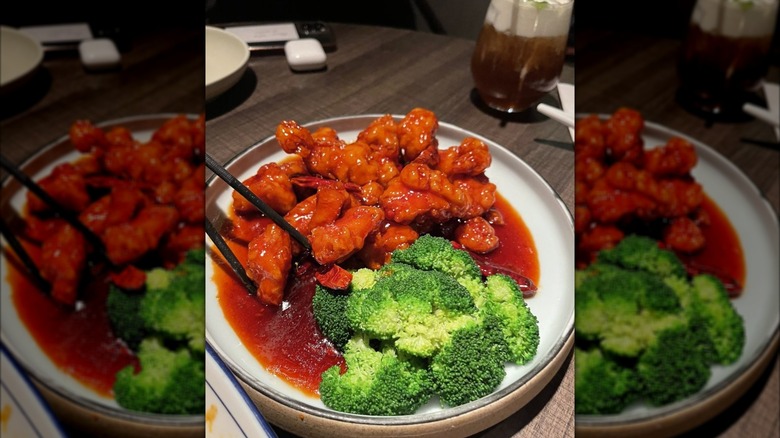 Plate of General Tso's chicken with side of broccoli at Uluh restaurant