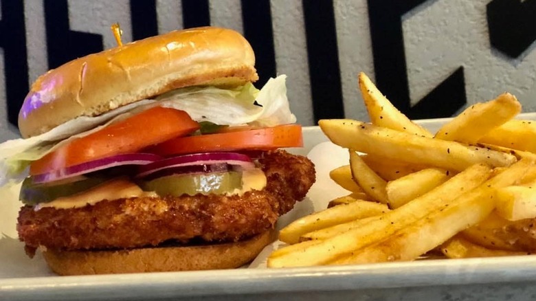 breaded pork tenderloin sandwich with fries