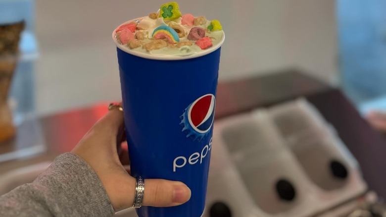 Cereal milkshake in paper Pepsi cup.