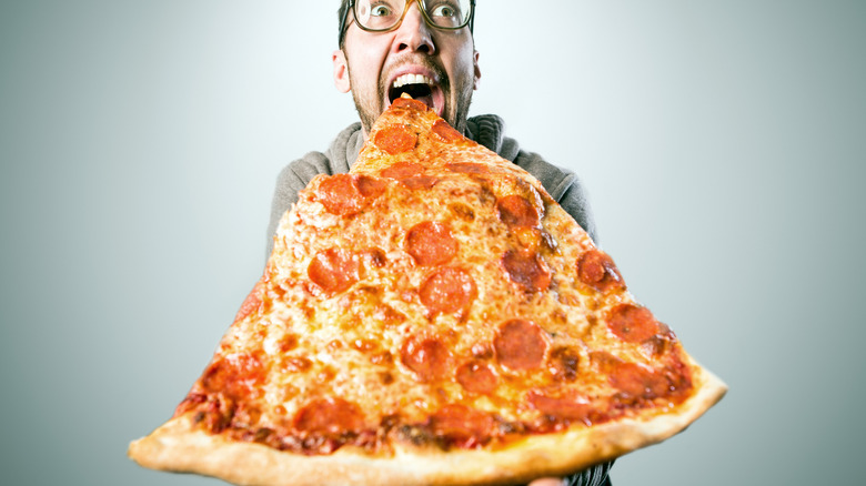 guy eating a jumbo slice