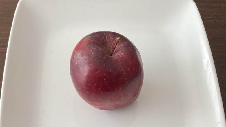 small Red Delicious apple on plate