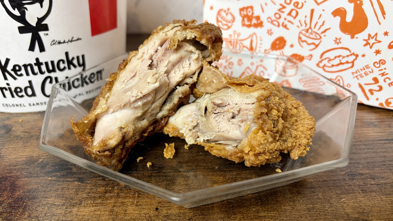 The inside of pieces of KFC and Popeyes fried chicken to compare the juiciness of each.