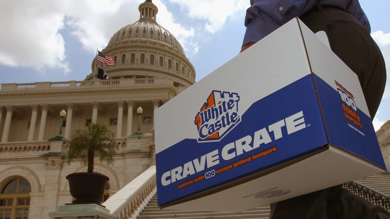 Person carrying White Castle box