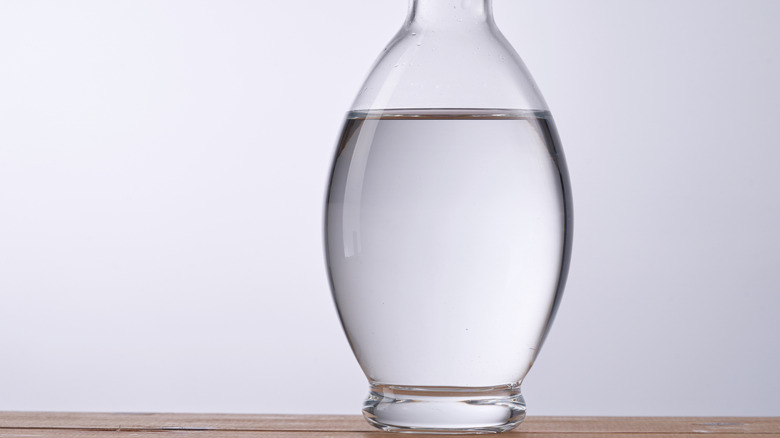 Glass bottle of clear vinegar