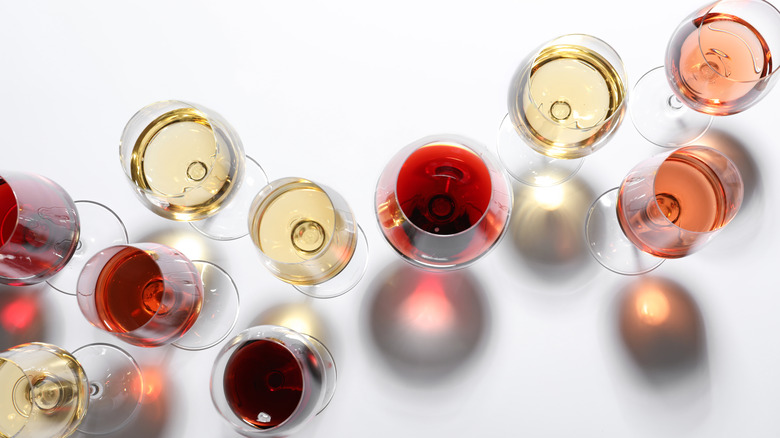 Different colors of wine in glasses from above